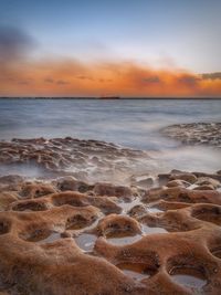 Scenic view of sea against sky during sunset