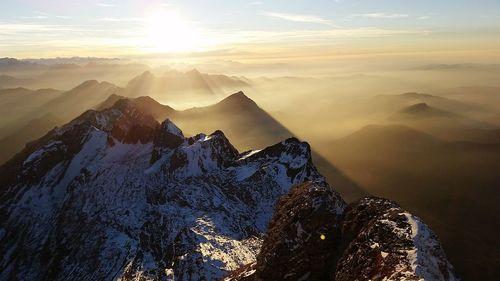 Scenic view of mountains against sky during sunset