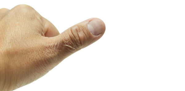 Close-up of hand against white background