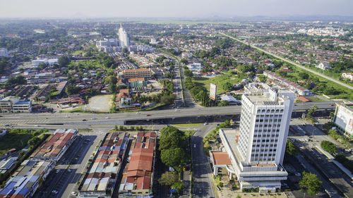 High angle view of buildings in city against sky
