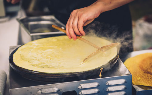 Close-up of man preparing food