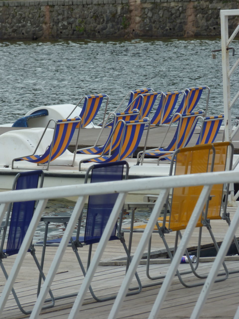 CHAIRS ON BEACH BY BOAT