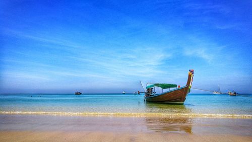 Scenic view of sea against clear blue sky