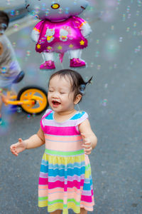 Full length of cute girl standing outdoors