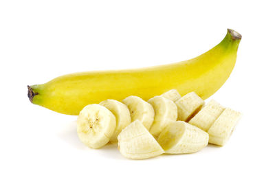 Close-up of bananas against white background