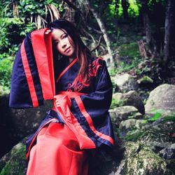 Portrait of a smiling woman in forest