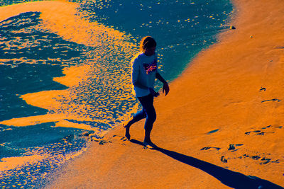 Full length of woman on sand