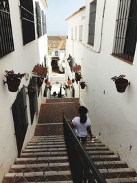 High angle view of people walking on staircase of building