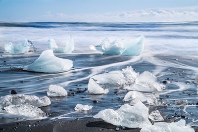 Icebergs on black sand at jokulsarlon lagoon