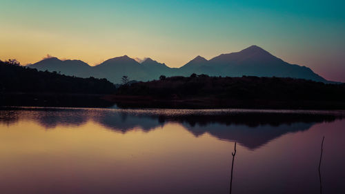 Scenic view of lake at sunset