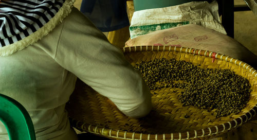 Close-up of man working in basket