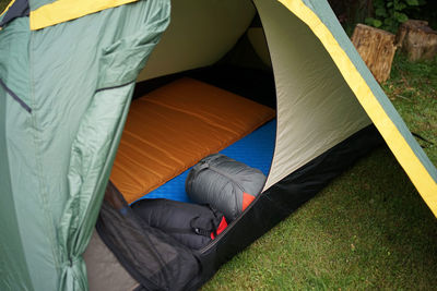 High angle view of person relaxing in tent