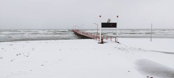 Scenic view of sea against sky during winter