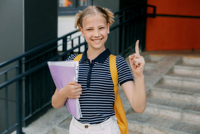 Portrait of young woman using mobile phone