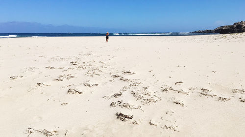 Scenic view of beach against clear sky