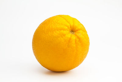 Close-up of lemon against white background