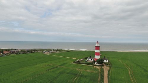 Scenic view of sea and buildings against sky