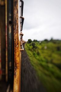 Close-up of railroad track against sky