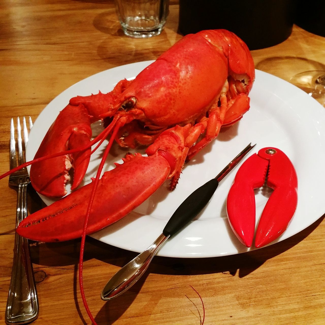 food and drink, indoors, food, table, red, still life, freshness, plate, healthy eating, high angle view, close-up, ready-to-eat, seafood, fork, serving size, tomato, no people, wood - material, slice, indulgence