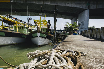 Boats moored at harbor