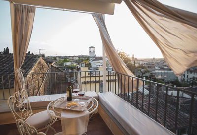 Glass of building against sky