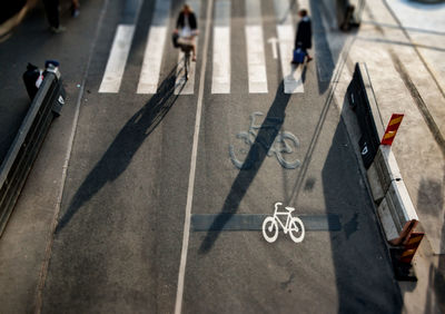 Low section of people walking on road