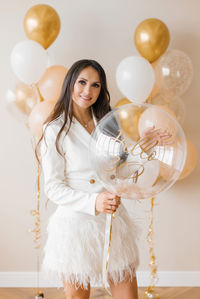Romantic happy european girl holding 30th birthday balloon