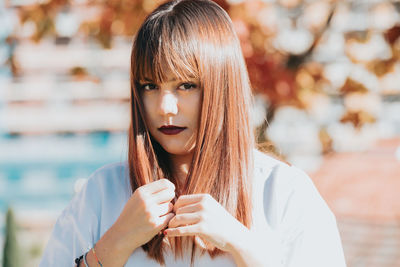 Portrait of young woman looking away