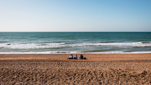 Scenic view of beach against clear sky