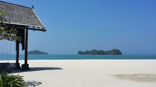 Scenic view of sea against clear blue sky