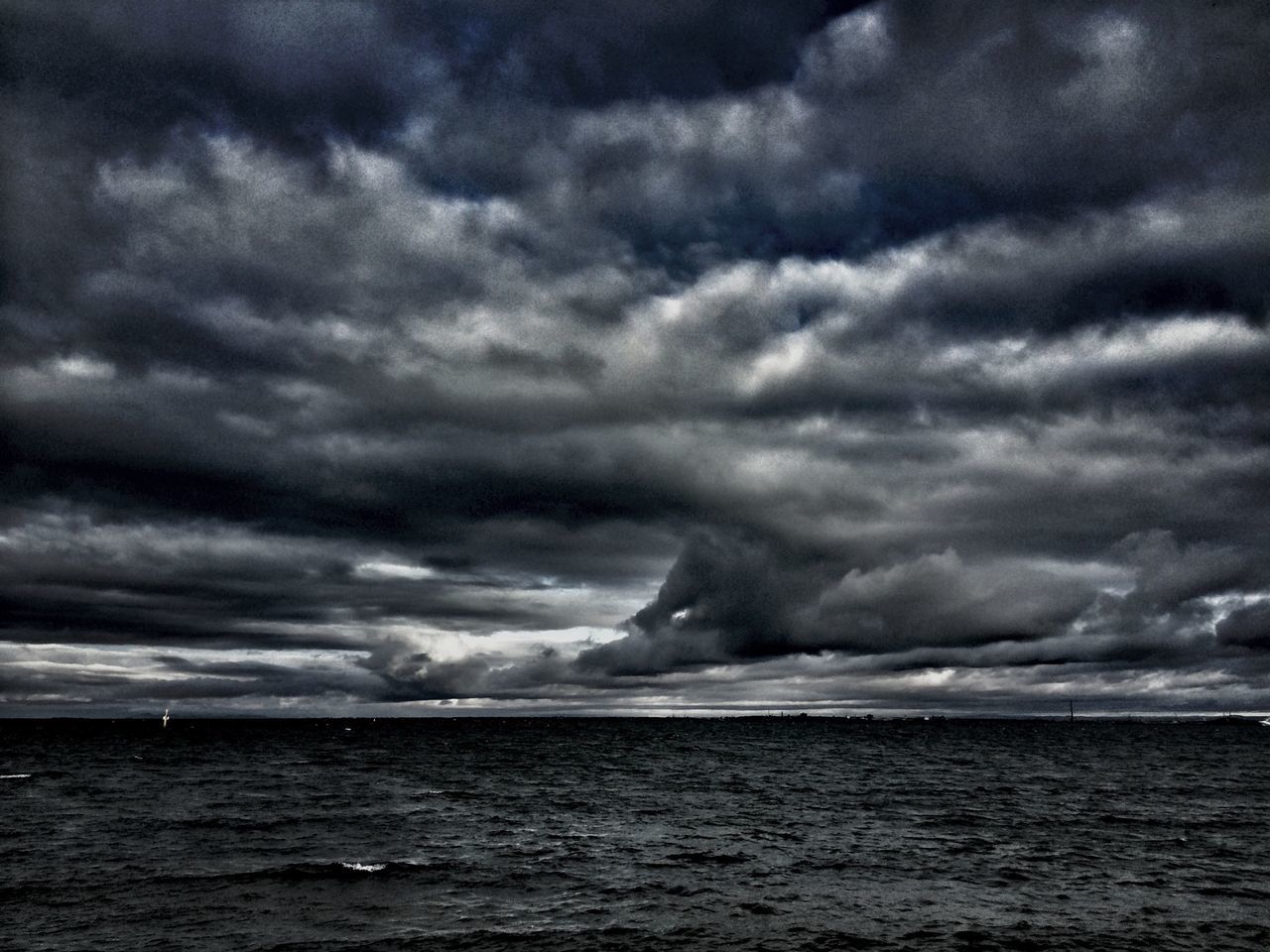 sea, sky, cloudy, water, cloud - sky, scenics, beauty in nature, tranquil scene, weather, tranquility, horizon over water, waterfront, storm cloud, overcast, nature, cloud, idyllic, dramatic sky, cloudscape, dusk