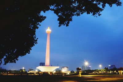 Low angle view of illuminated monument against sky at night