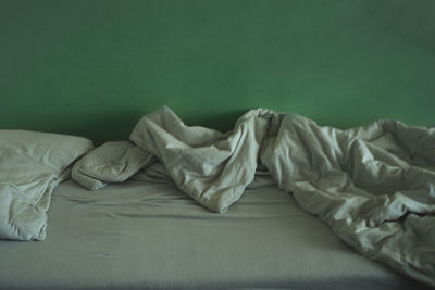 Close-up of relaxing on bed at home