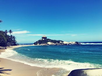 Scenic view of sea against blue sky