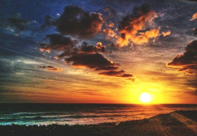 Scenic view of sea against sky at sunset