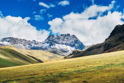 Scenic view of snowcapped mountains against sky