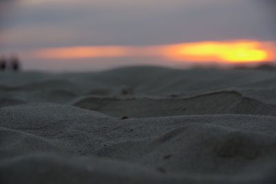 Scenic view of beach against sky during sunset