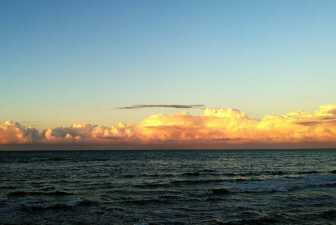 sea, horizon over water, water, scenics, tranquil scene, sunset, beauty in nature, tranquility, sky, waterfront, nature, rippled, idyllic, seascape, cloud, calm, majestic, orange color, blue, outdoors, cloud - sky, wave, non-urban scene, ocean, atmospheric mood, moody sky, atmosphere, no people, dramatic sky, water surface, vibrant color