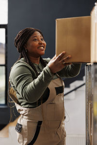 Portrait of young woman standing in store