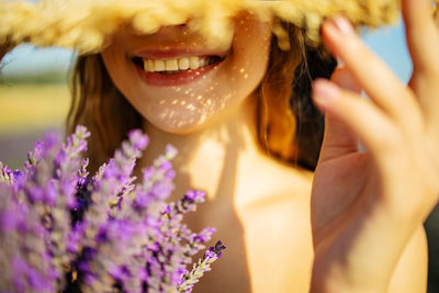 Close-up of woman with bouquet