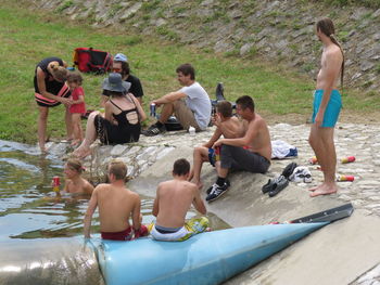 High angle view of people sitting in water