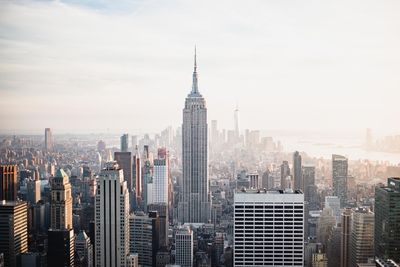 Modern buildings in city against sky