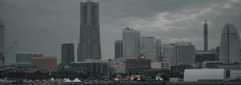 Modern buildings in city against sky