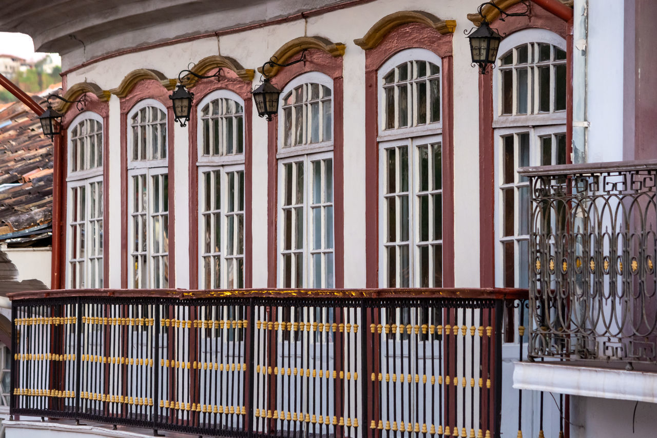 LOW ANGLE VIEW OF BUILDING WITH WINDOWS