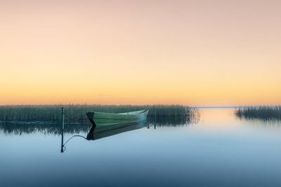 Scenic view of lake against sky during sunset