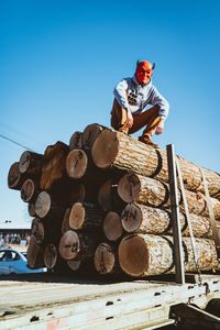 Low angle view of man working at construction site