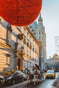 View of street amidst buildings in city