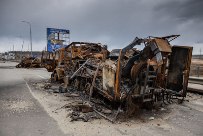 Military vehicles that burned down after being hit by a shell.