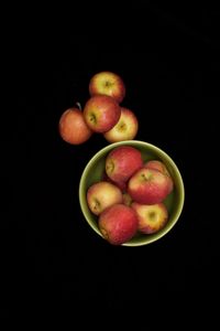 Close-up of apple against black background