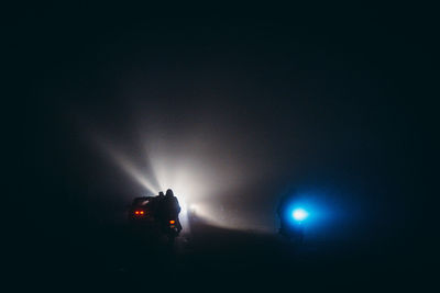 Low angle view of illuminated street light at night